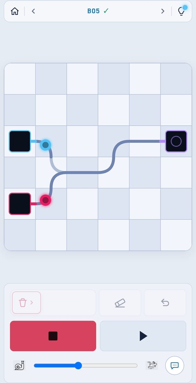 DotTracks level B05 — blue and red trains crossing paths on the way to their stations.
